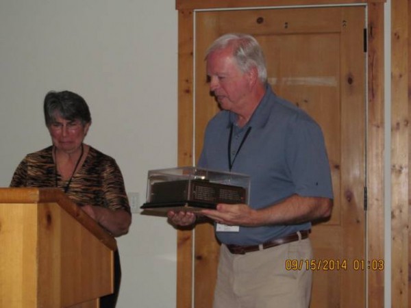 Hugh Guynes accepting the Keith Porter Award -Tiger from Pam Jeffers