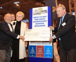 Sir Stirling Moss and Rosemary Smith join RACT chairman Gordon Jarvis in accepting a cheque